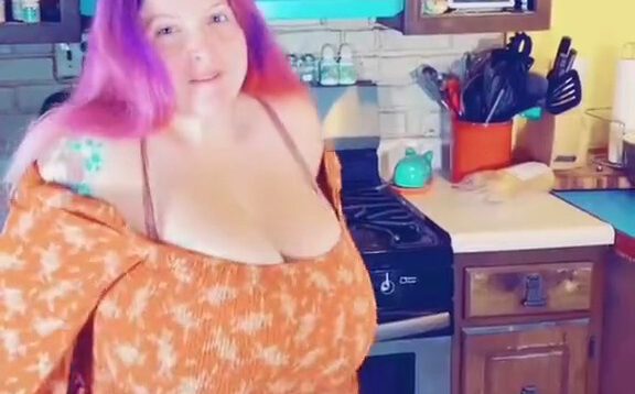Demora Avarice giant tits in an orange dress
